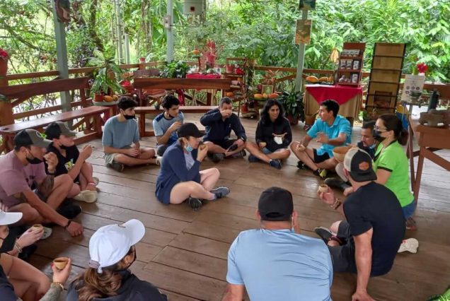 A group of people enjoying a Chocolate Experience Tour on a wooden deck.