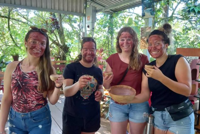 A group of women are smiling while holding a Chocolate Experience Tour.