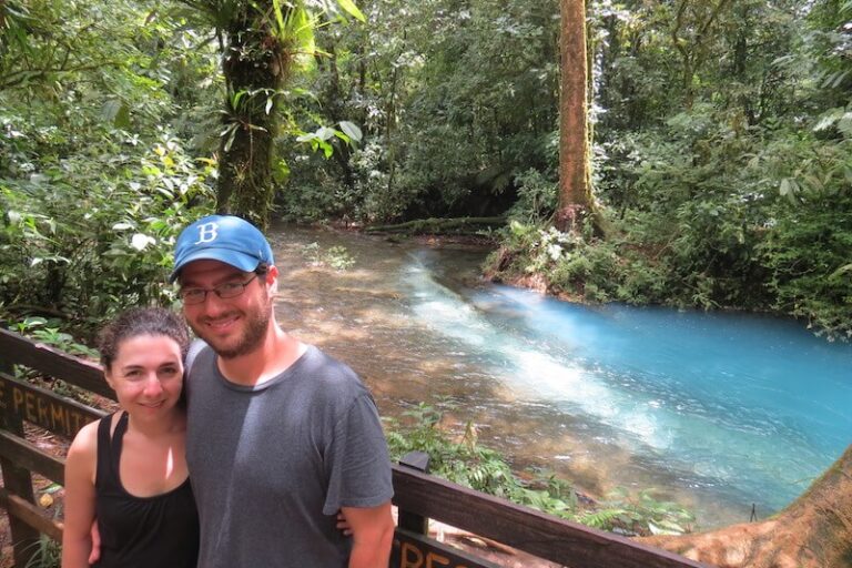 Rio celeste photo A couple posing for photo, at the background The Rio Celeste