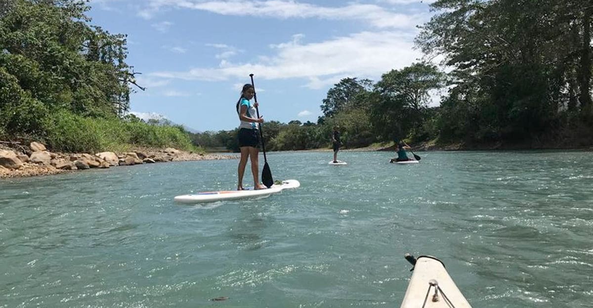 A girl on a SUP in the rio frio with morning light