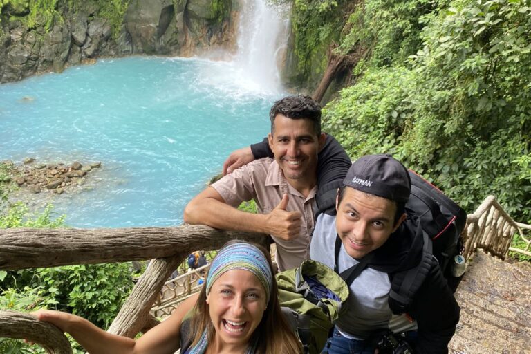 Onca Tours experience A group of friends having behind the Rio Celeste Waterfall