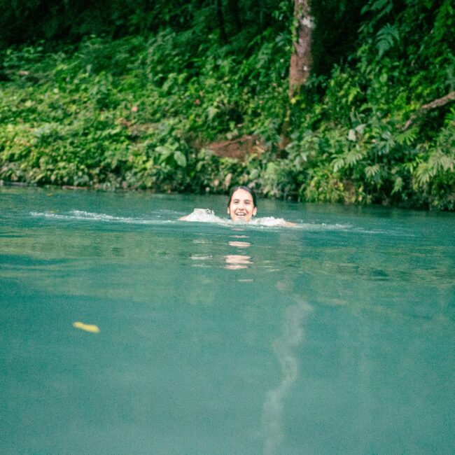 Girl Swimming In Rio Celeste