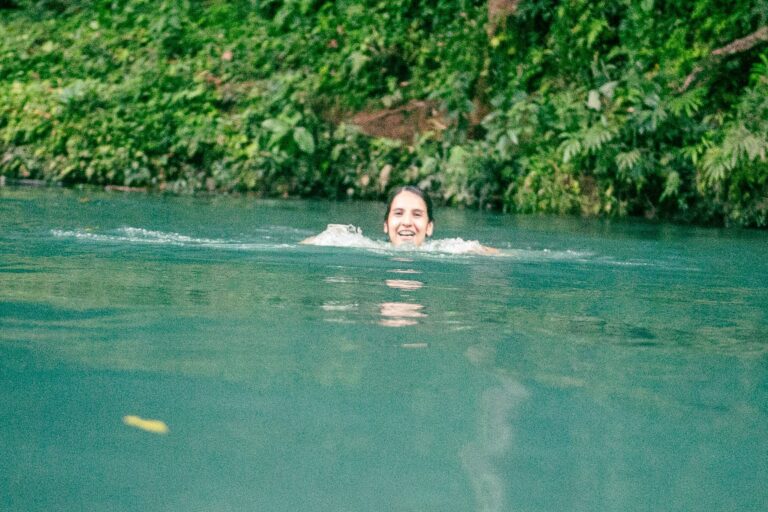 Girl Swimming In Rio Celeste