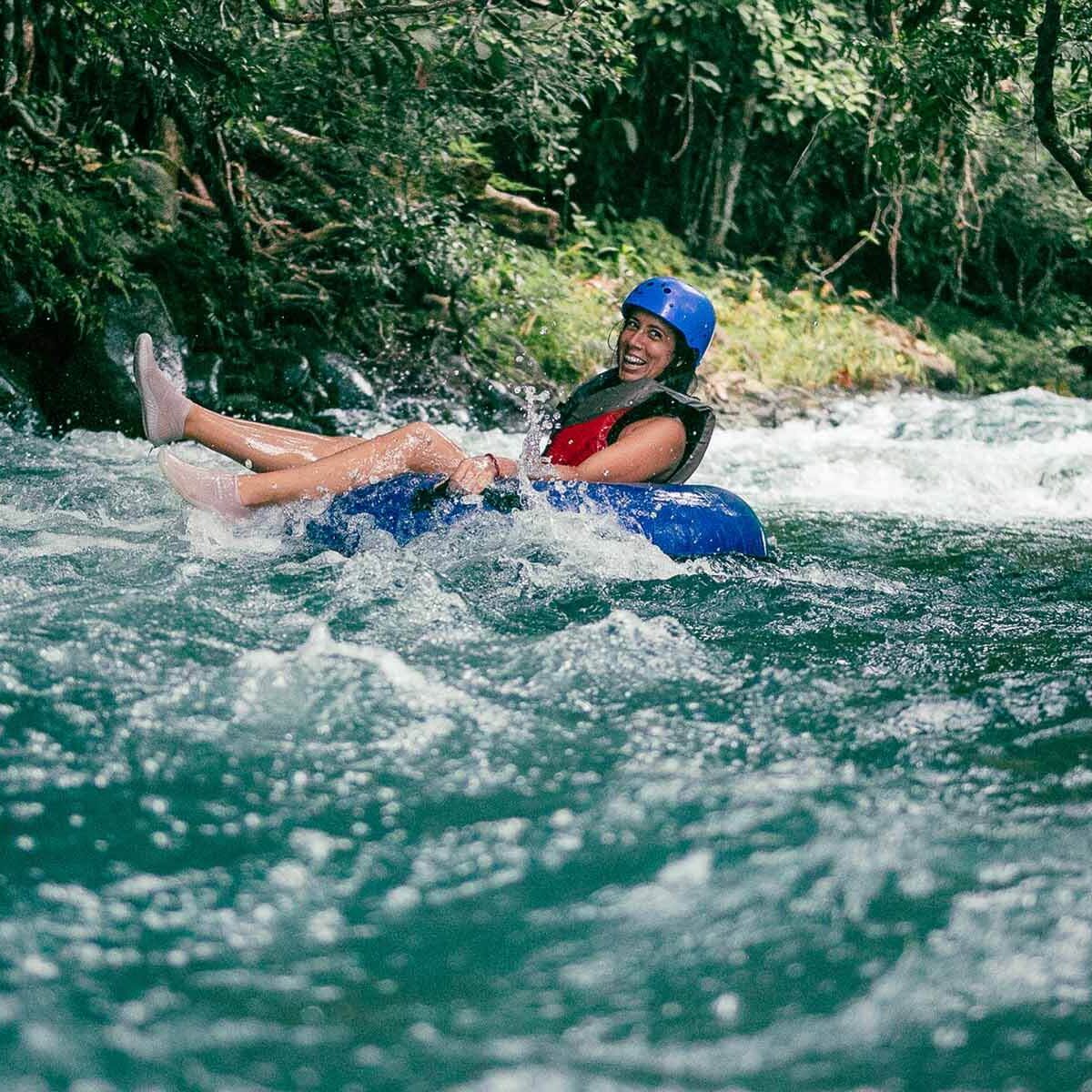Girl Tubing Down in Rio Celeste Costa Rica