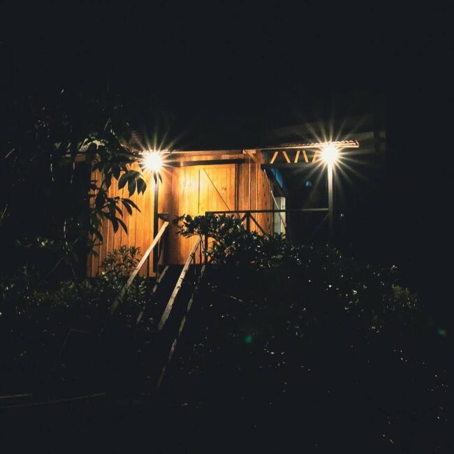 A panoramic view at night of a tree house costa rica