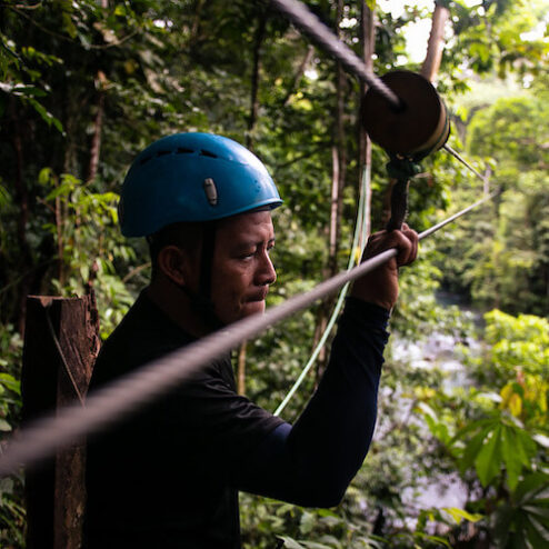 A man moving through zip line