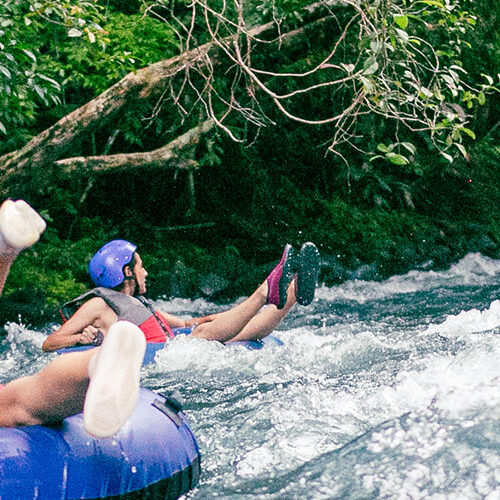 two girls tubing down in rio celeste