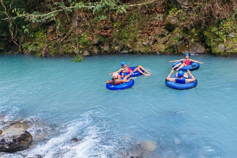 WhatsApp Image 2023-06-13 at 13.45.19 A group of people tubing in Rio Celeste