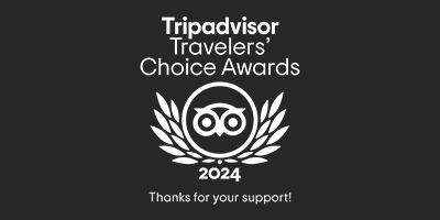 Tripadvisor Travelers' Choice Awards 2024 logo with laurel wreath and text "Thanks for your support!" on a dark background.